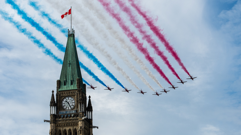 RAF Red Arrows flying past Parliament Hill in Ottawa, Canada, 13 August 2019.