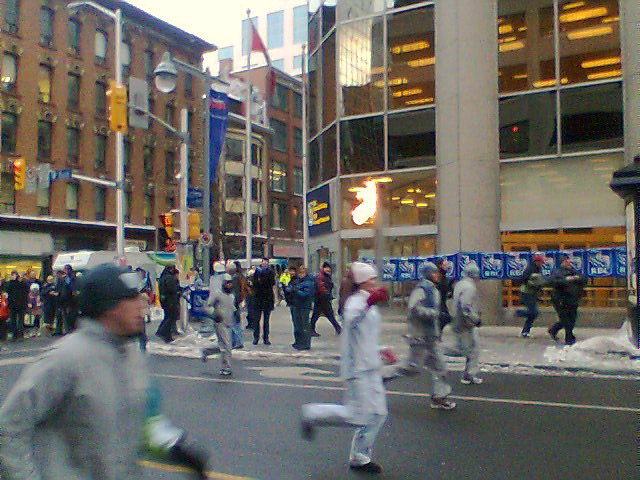 Olympic flame on its way to the 2010 Vancouver Winter Olympics, on Bank Street in Ottawa.